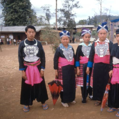 Young women in New Year dress with silver collars
